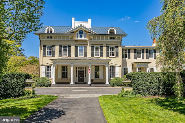 15 Hodge Rd, Princeton, NJ 08540 - view of front facade with a porch, a standing seam roof, and stucco siding