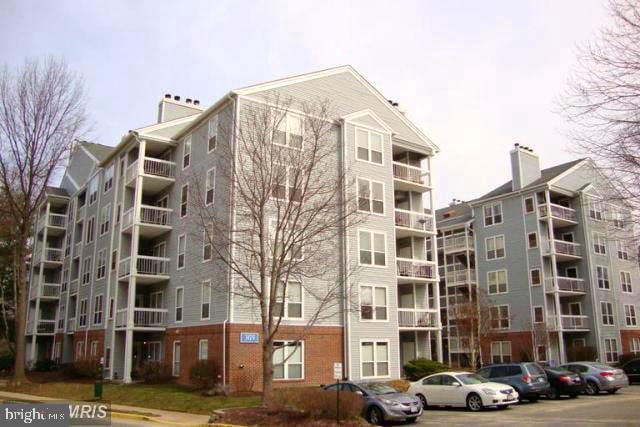 3176 Summit Square Dr Unit 4-D7, Oakton, VA 22124 - view of apartment building / complex with uncovered parking