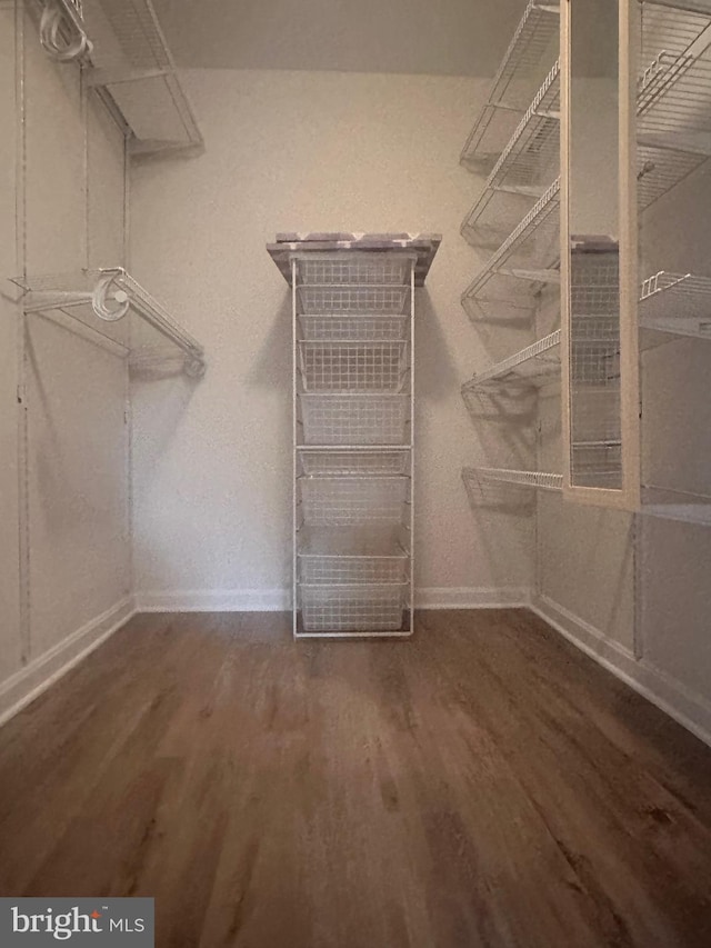 3176 Summit Square Dr Unit 4-D7, Oakton, VA 22124 - walk in closet featuring wood finished floors