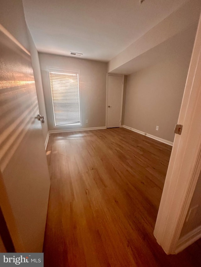 3176 Summit Square Dr Unit 4-D7, Oakton, VA 22124 - empty room with wood finished floors and baseboards