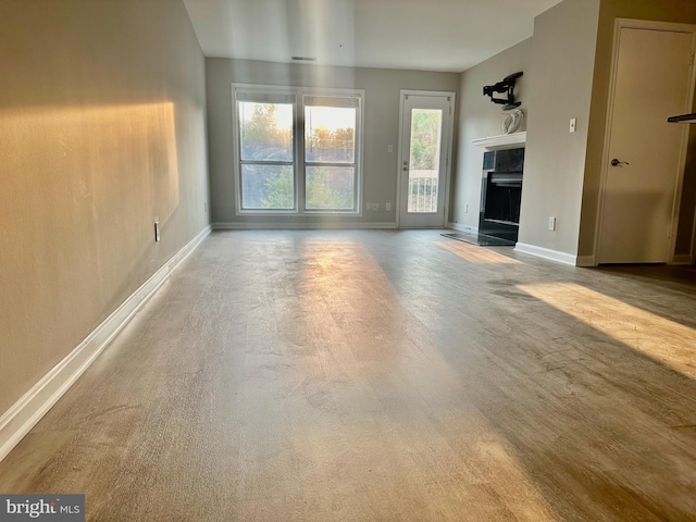 3176 Summit Square Dr Unit 4-D7, Oakton, VA 22124 - unfurnished living room featuring a fireplace and baseboards