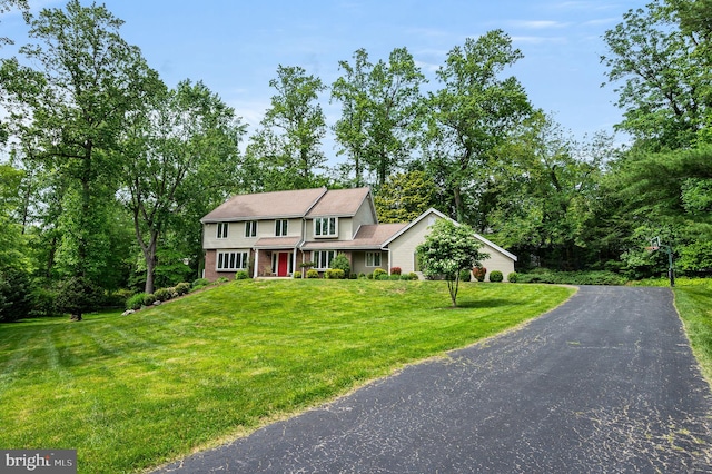 211 Fox Ln, Wallingford, PA 19086 - view of front facade with a front lawn and driveway