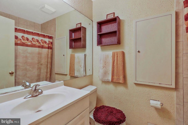 11104 Lund Pl, Kensington, MD 20895 - full bathroom featuring vanity, a textured wall, and a shower with shower curtain