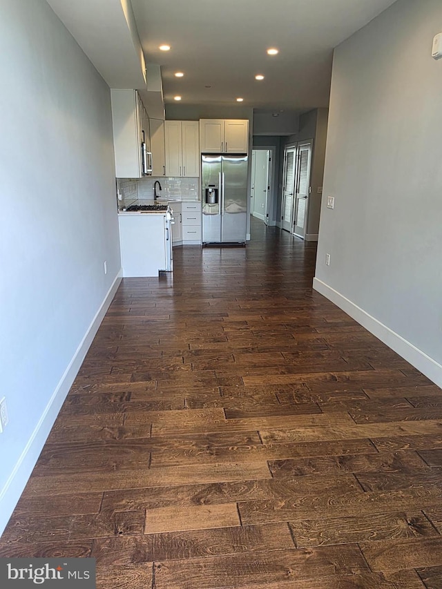 1101 Fern St NW Unit 301, Washington, DC 20012 - unfurnished living room with dark wood finished floors and recessed lighting