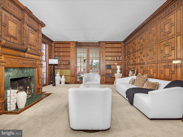 4332 N Charles St, Baltimore, MD 21218 - carpeted living room featuring a premium fireplace, crown molding, and wooden walls