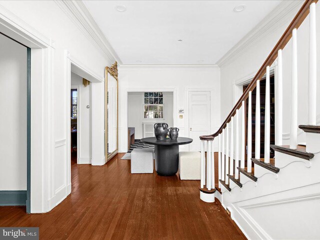 4332 N Charles St, Baltimore, MD 21218 - corridor with ornamental molding, dark wood-style floors, and stairs