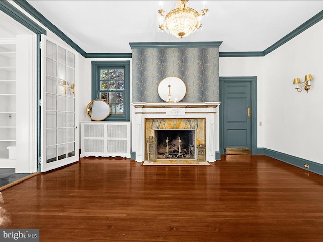 4332 N Charles St, Baltimore, MD 21218 - unfurnished living room featuring ornamental molding, wood finished floors, a high end fireplace, a chandelier, and radiator