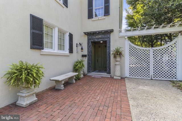 4332 N Charles St, Baltimore, MD 21218 - entrance to property featuring stucco siding and a patio area