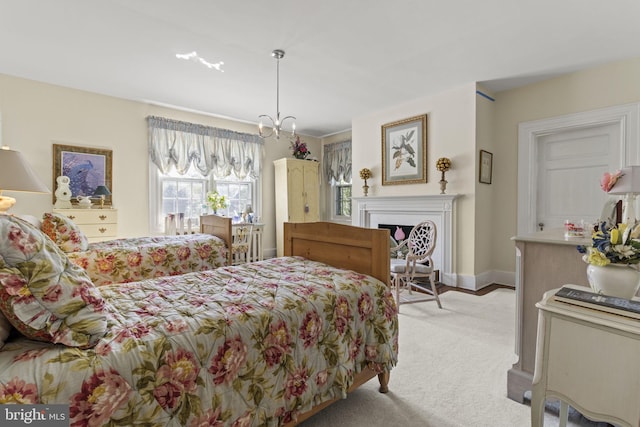 4332 N Charles St, Baltimore, MD 21218 - bedroom with light carpet, a fireplace, and a chandelier