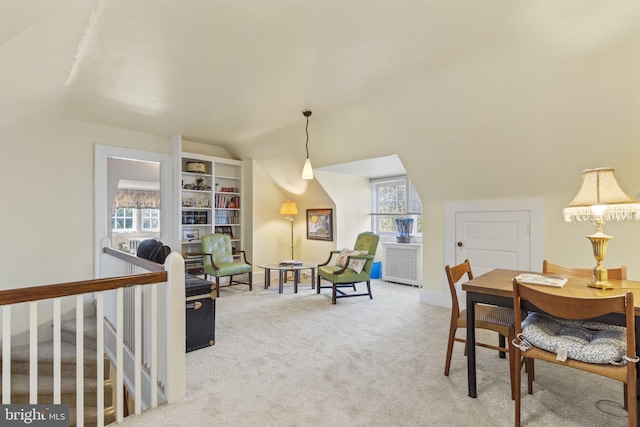 4332 N Charles St, Baltimore, MD 21218 - dining space featuring vaulted ceiling, radiator heating unit, and carpet floors
