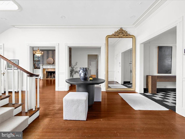 4332 N Charles St, Baltimore, MD 21218 - hall with stairway, dark wood-type flooring, ornamental molding, and a chandelier