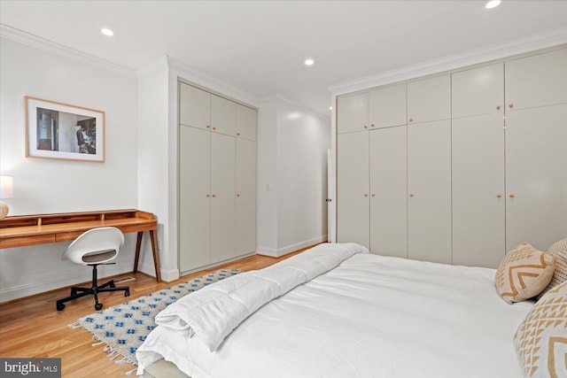 7 U St NW, Washington, DC 20001 - bedroom featuring two closets, crown molding, light wood-style flooring, and recessed lighting