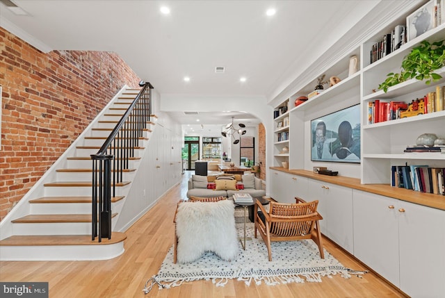 7 U St NW, Washington, DC 20001 - living area with arched walkways, stairs, light wood-style floors, recessed lighting, and brick wall