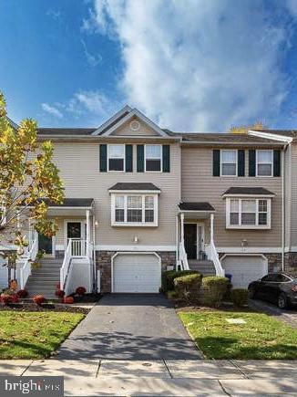 31 Hoag Ln, Aston, PA 19014 - view of front facade featuring a garage and driveway