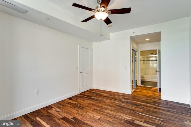 3650 S Glebe Rd Unit 239, Arlington, VA 22202 - unfurnished bedroom with dark wood finished floors, ensuite bathroom, and ceiling fan