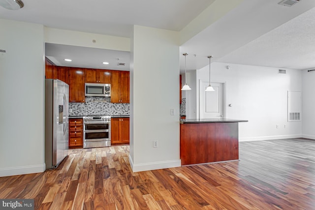 3650 S Glebe Rd Unit 239, Arlington, VA 22202 - kitchen with appliances with stainless steel finishes, wood finished floors, open floor plan, decorative backsplash, and recessed lighting