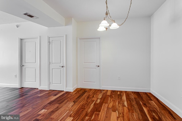 3650 S Glebe Rd Unit 239, Arlington, VA 22202 - empty room featuring a chandelier and dark wood-type flooring