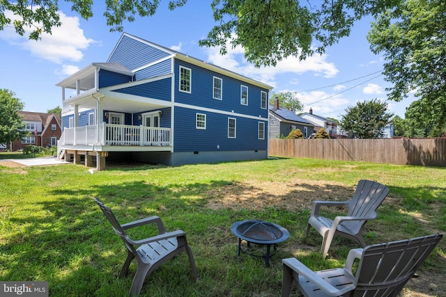 2910 Georgia Ave, Halethorpe, MD 21227 - back of house featuring a fire pit, a deck, and crawl space