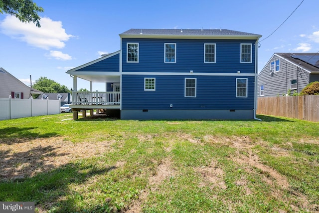 2910 Georgia Ave, Halethorpe, MD 21227 - back of property with crawl space and a wooden deck