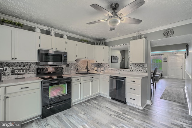 840 W Spring Meadow Ct, Edgewood, MD 21040 - kitchen with appliances with stainless steel finishes, a textured ceiling, ornamental molding, light countertops, and decorative backsplash