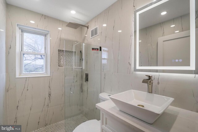 1539 K St SE, Washington, DC 20003 - full bath with a marble finish shower, tile walls, and vanity