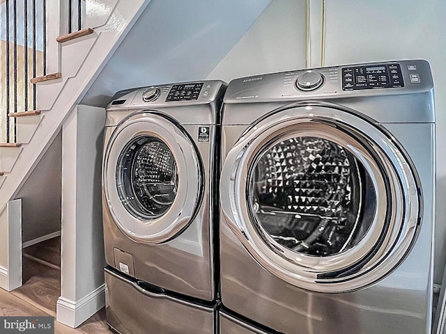 1539 K St SE, Washington, DC 20003 - laundry area with washing machine and dryer and wood finished floors