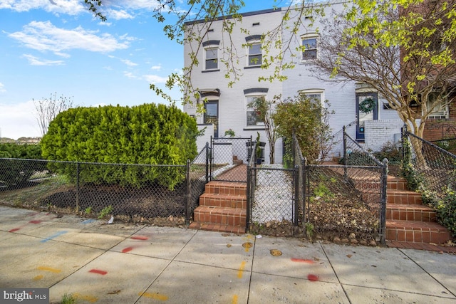 1539 K St SE, Washington, DC 20003 - multi unit property featuring a gate, a fenced front yard, and brick siding