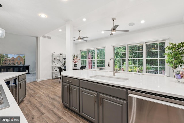 1508 Cornerstone Ct, Crownsville, MD 21032 - kitchen with stainless steel dishwasher, wood finished floors, light countertops, ceiling fan, and recessed lighting