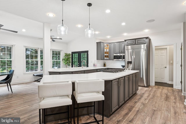1508 Cornerstone Ct, Crownsville, MD 21032 - kitchen with appliances with stainless steel finishes, gray cabinets, light countertops, light wood-type flooring, and a ceiling fan