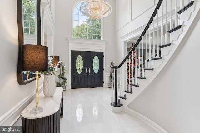 1508 Cornerstone Ct, Crownsville, MD 21032 - foyer featuring a chandelier, plenty of natural light, stairway, tile patterned floors, and a high ceiling