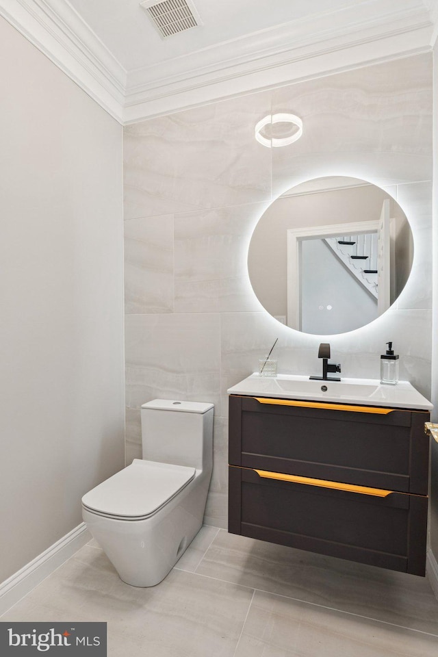 1508 Cornerstone Ct, Crownsville, MD 21032 - bathroom featuring ornamental molding, vanity, and tile walls