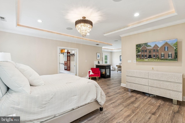 1508 Cornerstone Ct, Crownsville, MD 21032 - bedroom with a tray ceiling, ornamental molding, wood finished floors, a chandelier, and recessed lighting