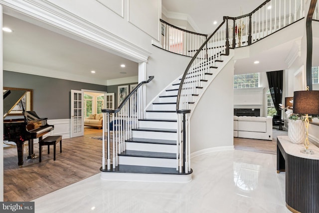 1508 Cornerstone Ct, Crownsville, MD 21032 - stairway with crown molding, plenty of natural light, french doors, recessed lighting, and wainscoting