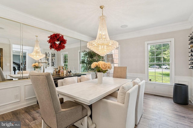 1508 Cornerstone Ct, Crownsville, MD 21032 - dining space with a chandelier, wood-type flooring, wainscoting, crown molding, and a decorative wall
