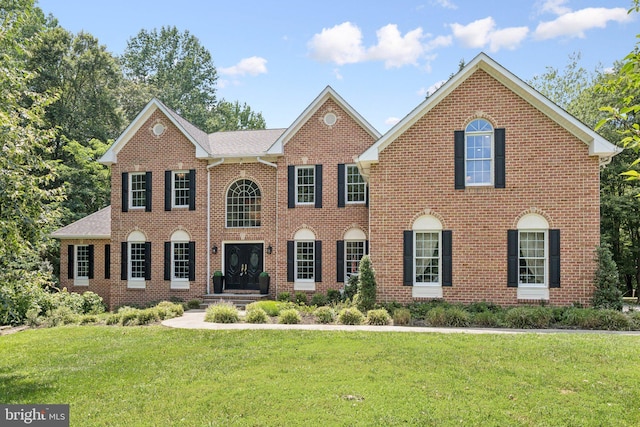 1508 Cornerstone Ct, Crownsville, MD 21032 - colonial-style house featuring brick siding and a front yard