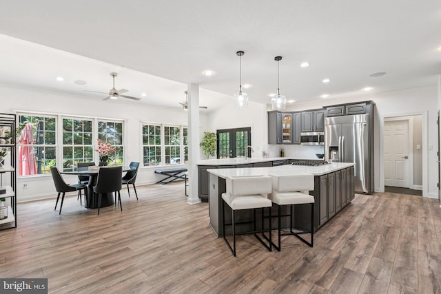 1508 Cornerstone Ct, Crownsville, MD 21032 - kitchen featuring appliances with stainless steel finishes, light countertops, light wood-style floors, gray cabinets, and ceiling fan