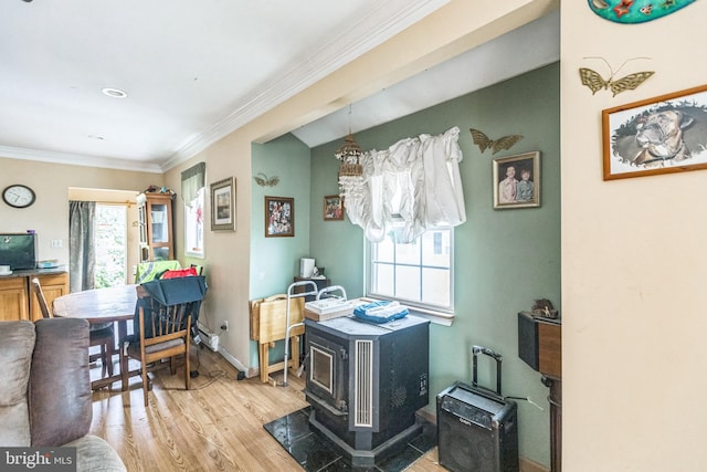 104 Elm Ave, Glen Burnie, MD 21061 - dining area with a wood stove, wood finished floors, and crown molding