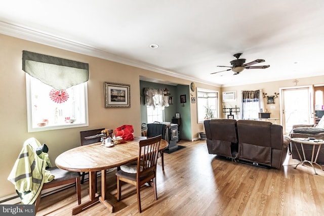 104 Elm Ave, Glen Burnie, MD 21061 - dining area featuring light wood finished floors, a ceiling fan, ornamental molding, and a wall mounted AC