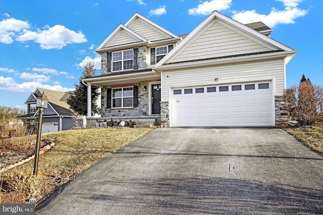 230 Joshua Dr, York, PA 17404 - traditional-style home with stone siding, driveway, and a garage