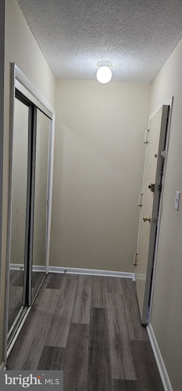 10725 W Dr Unit 301, Fairfax, VA 22030 - hallway featuring wood finished floors and a textured ceiling
