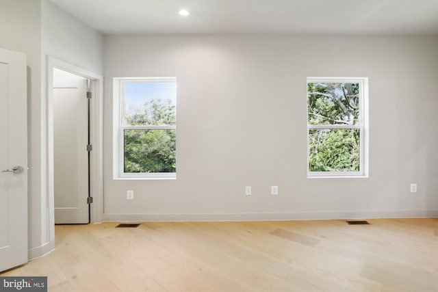 4900 D St SE, Washington, DC 20019 - empty room featuring light wood-style flooring, plenty of natural light, and recessed lighting