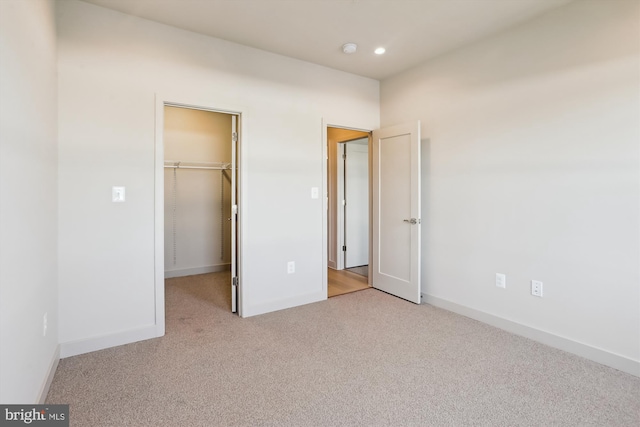 4900 D St SE, Washington, DC 20019 - unfurnished bedroom with carpet flooring, a spacious closet, a closet, and recessed lighting