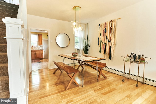 2426 E Indiana Ave, Philadelphia, PA 19134 - dining room with stairway, light wood-style floors, healthy amount of natural light, and baseboard heating