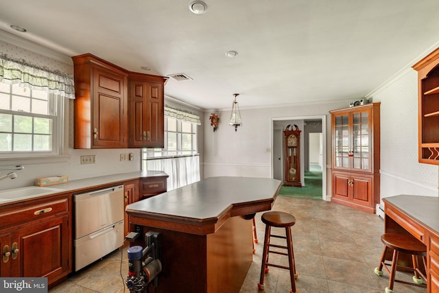 60 Ridge View Dr, Leola, PA 17540 - kitchen featuring wallpapered walls, stainless steel dishwasher, ornamental molding, a breakfast bar, and a kitchen island