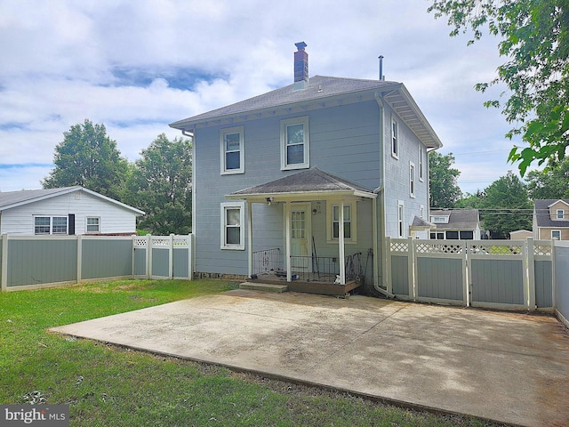 370 Nicholson Rd, Baltimore, MD 21221 - rear view of property with a chimney, a patio, a fenced backyard, and a gate