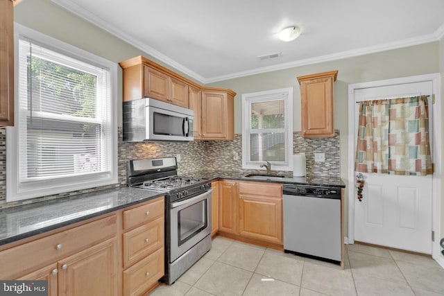 370 Nicholson Rd, Baltimore, MD 21221 - kitchen featuring appliances with stainless steel finishes, tasteful backsplash, light tile patterned flooring, ornamental molding, and dark stone countertops
