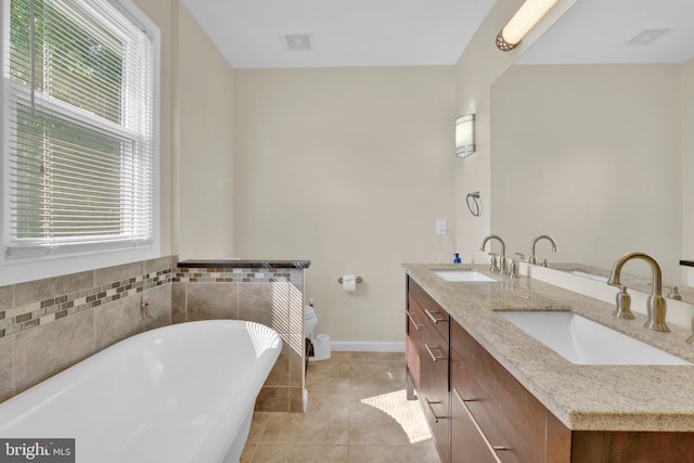 370 Nicholson Rd, Baltimore, MD 21221 - bathroom featuring a freestanding tub, tile patterned flooring, and double vanity