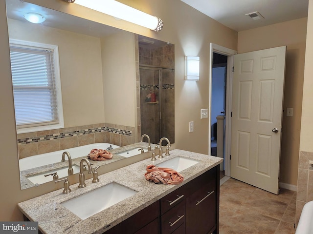 370 Nicholson Rd, Baltimore, MD 21221 - full bathroom featuring a garden tub, a shower stall, double vanity, and tile patterned flooring