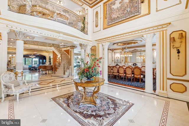 423 Seneca Rd, Great Falls, VA 22066 - building lobby with ornamental molding, a towering ceiling, and stairs