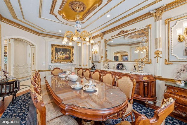 423 Seneca Rd, Great Falls, VA 22066 - dining space featuring ornamental molding, a chandelier, wood finished floors, and a decorative wall